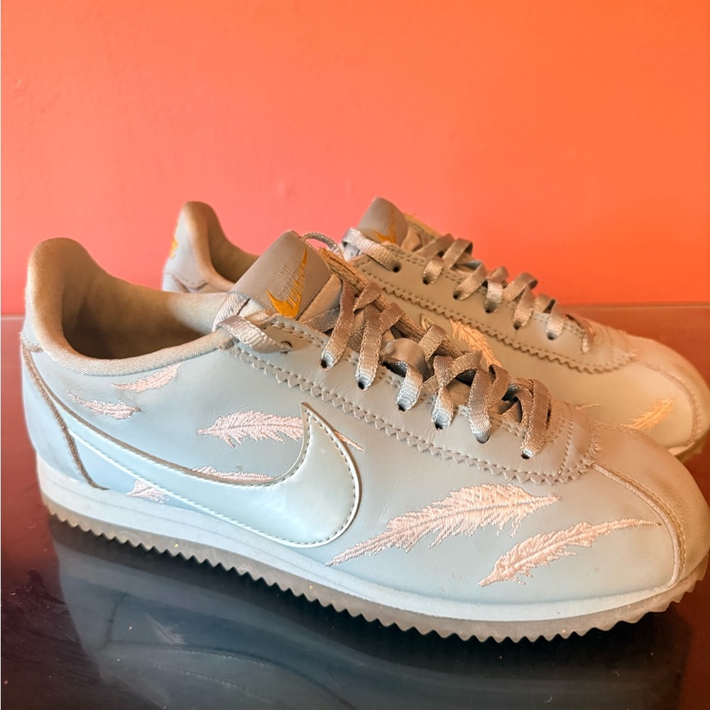 Nike Classic Cortez Sneakers in Light Blue with White Embroidered Feathers